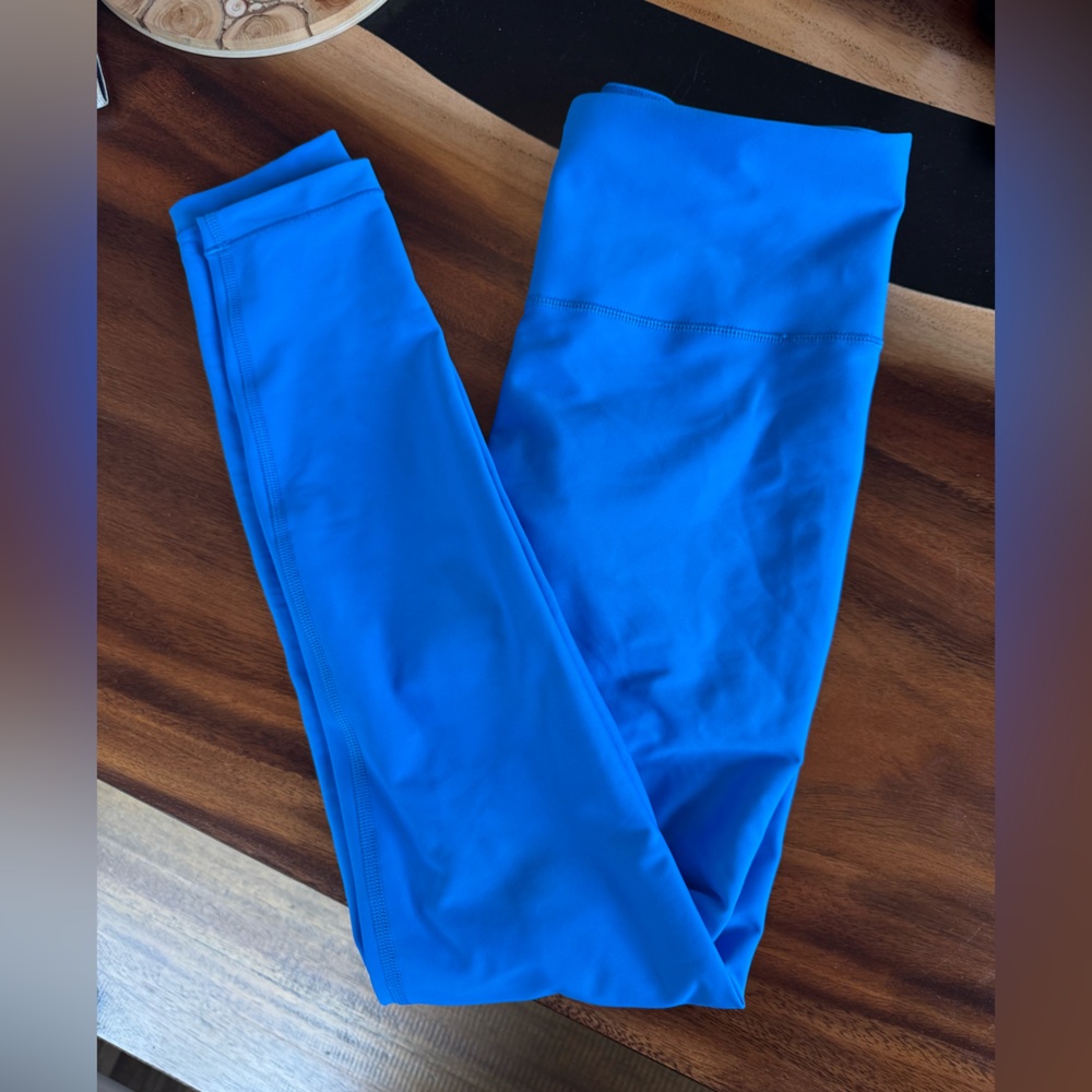 Like new Athleta blue interval tight size small with drawstring